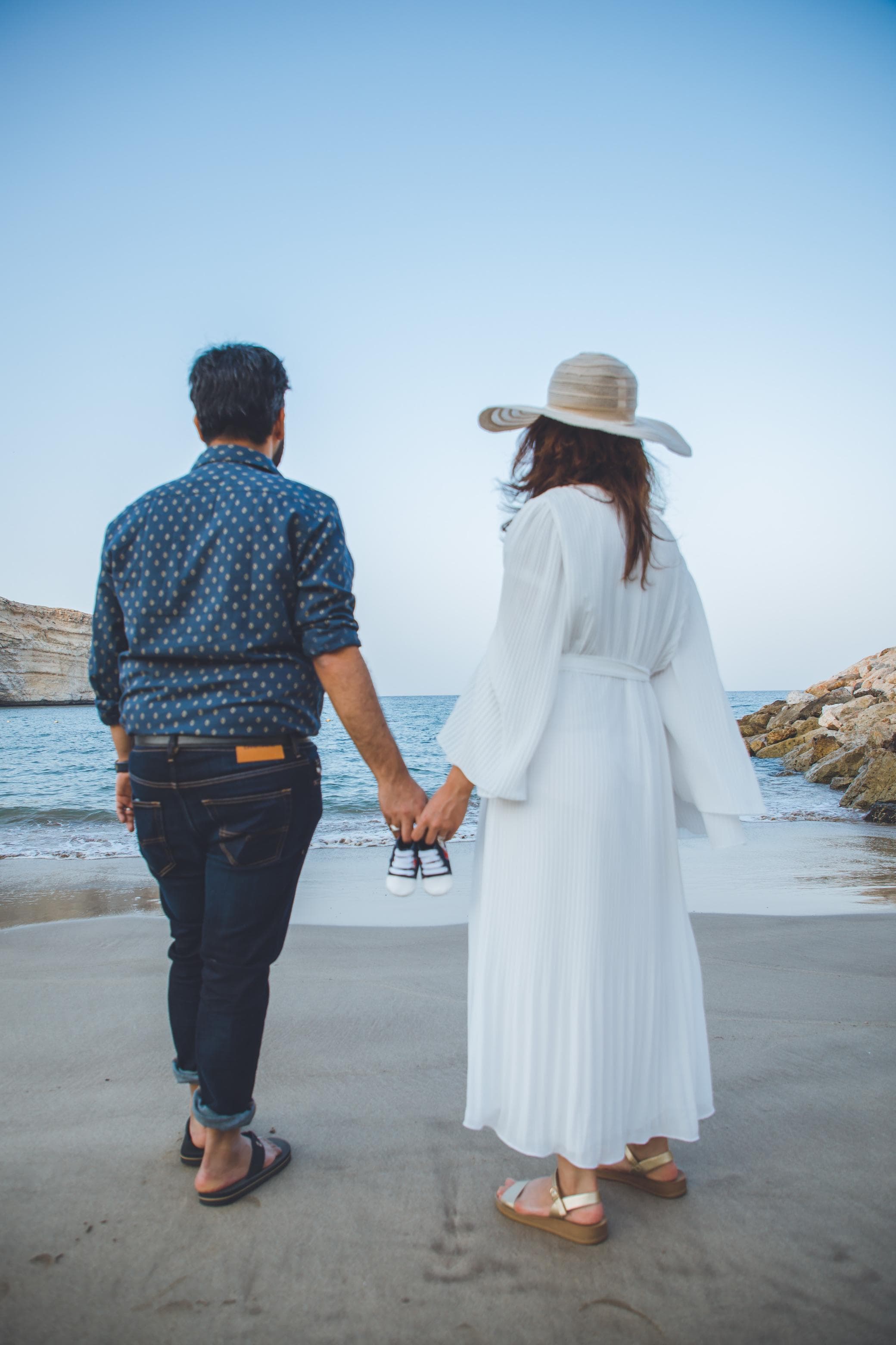 Beach pregnancy announcement shoot at sunset